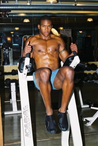Black gay with hot muscles Houston A exposes his big prick after a gym workout