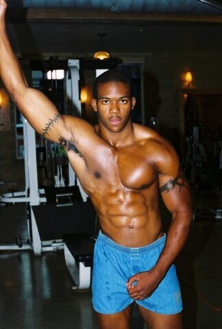 Black gay with hot muscles Houston A exposes his big prick after a gym workout