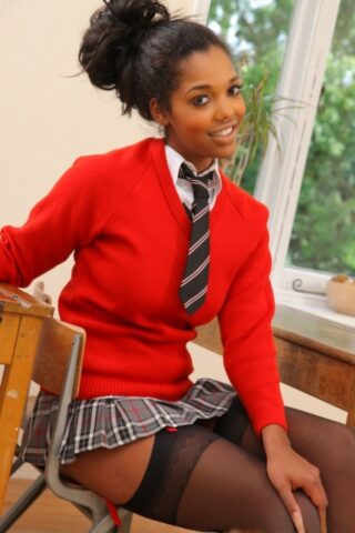 87294635_021_4911 Ebony Rehea flashes her breasts and poses in black stockings in the classroom