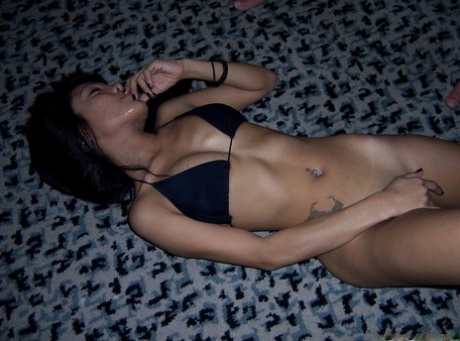 88220689_024_5c62 Horny Filipina Roseanne strips and showcases her skinny tattooed body