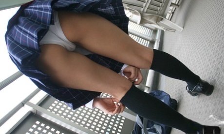 89334926_004_50d2 Lusty asian coed in uniform flashing her panties and tiny tits
