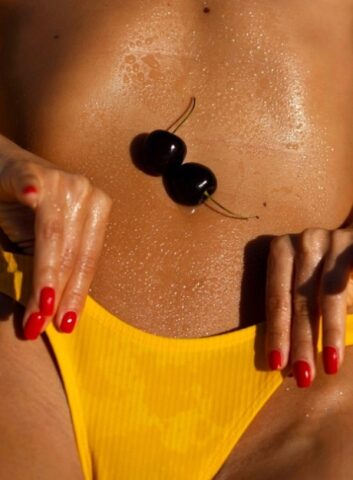 89863669_012_47f6 Italian babe Natalia Andreeva flaunts her tanned body & big tits on the beach