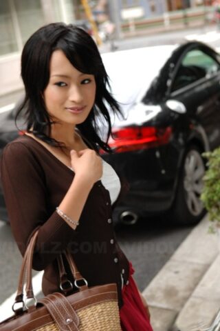 92670216_011_da5e Japanese beauty Mio Kanna strolls downtown in a knee-length skirt