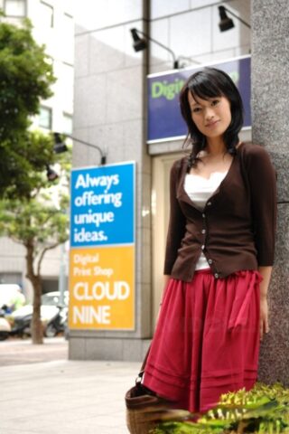 92670216_012_f051 Japanese beauty Mio Kanna strolls downtown in a knee-length skirt