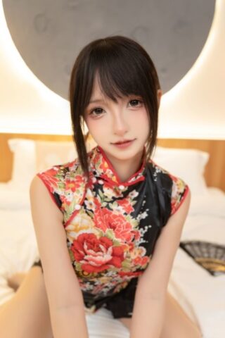 Asian wife sex doll shows her feet and flashes her upskirt on her bed