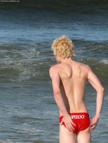 Horny gay blonde Jarrod plays with his uncut dick on the beach and at home