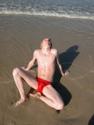Horny gay blonde Jarrod plays with his uncut dick on the beach and at home