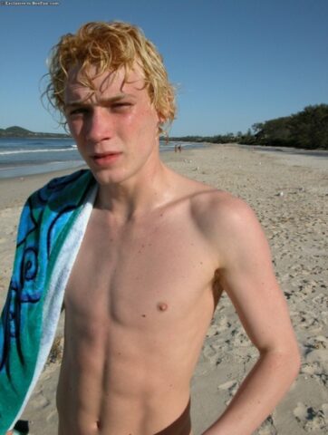Horny gay blonde Jarrod plays with his uncut dick on the beach and at home