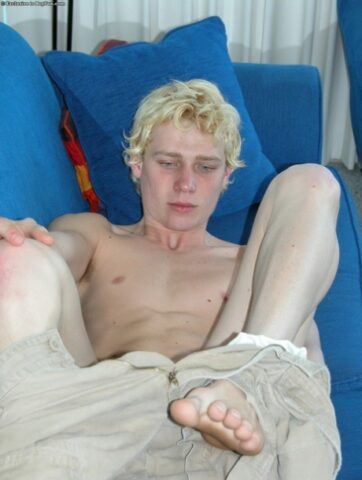 Horny gay blonde Jarrod plays with his uncut dick on the beach and at home
