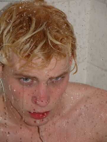 Horny gay blonde Jarrod plays with his uncut dick on the beach and at home