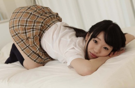 Petite Asian schoolgirl Yuna Himekawa gets her hairy twat toyed and fucked