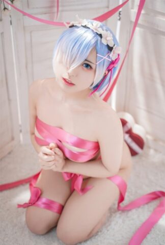 96184833_002_ac2a Beautiful Asian model with big tits poses while wrapped in pink satin ribbon