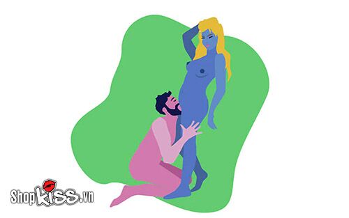 Người đàn ông quỳ gối thực hiện kỹ năng vét máng cho bạn tình ở tư thế đứng