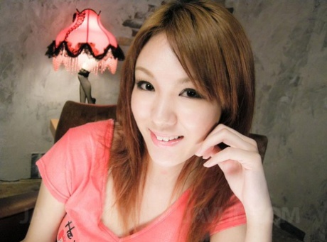 Japanese redhead Rei takes a cumshot on her tongue while being masturbated