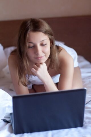 60484648_002_438c Charming babe Nikia showing her puffy nipples & shaved muff in her bedroom