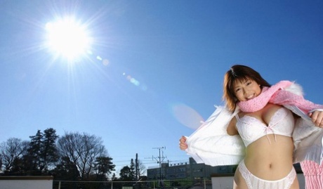 61727821_008_624a Japanese MILF Mai Haruna undoes her winter coat while wearing a bra and thong