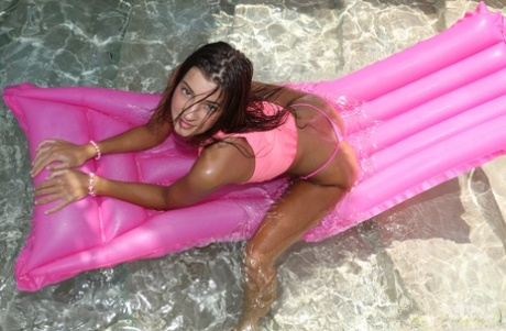 13906253_008_f030 Gorgeous Melena Tara poses poolside in a pink bikini & gets her hot body wet