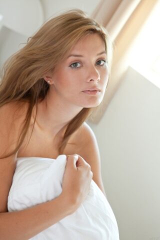 72313270_093_7afb Absolutely gorgeous teen Edwige A shows her trimmed cunt on a bed up close