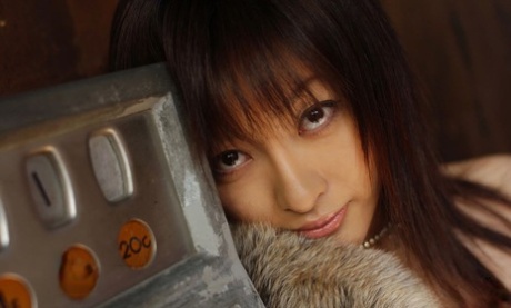 49049416_002_9321 Japanese model Sakura Shiratori thrusts her big tits forward once she